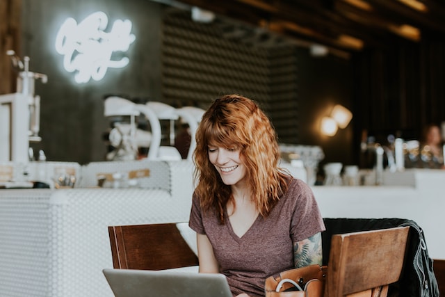 Woman Writing Review For Organix Essentials